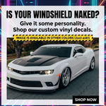 “Custom windshield banner decal with YOUR TEXT in white vinyl, approx. 55×6 in, die‑cut with no background on tinted glass”