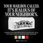 Mailbox decal with daisies flanking a banner, custom family name, black vinyl on black mailbox, approx. 12×6in”