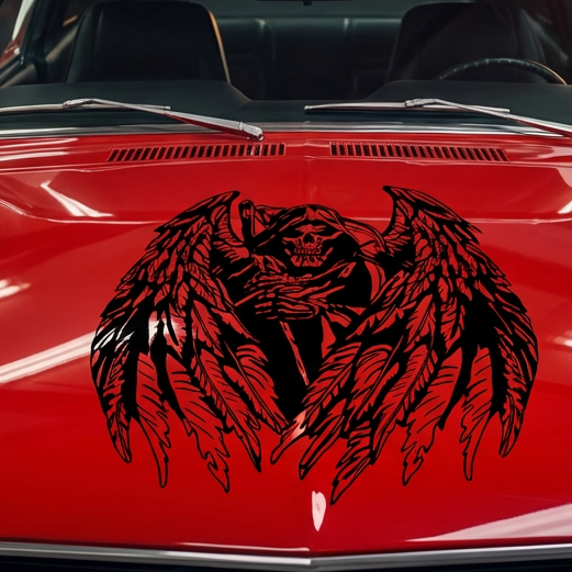 "Black vinyl decal of hooded Grim Reaper skull with large feathered angel wings, centered on red muscle car hood."

