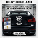 “One Foot in the Grave" vinyl car window decal, white, 15×20, die‑cut with no background on  rear of car