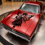 Red car with a large black gothic fairy butterfly vinyl decal applied to the hood, featuring a bold fantasy design.