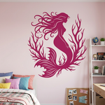 Pink mermaid wall decal on a pink wall with a bed and desk in the background.