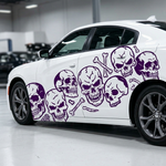 Skulls and bones vinyl decal in purple on white car, large size