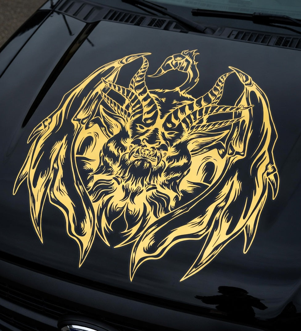 Muscle car with a large black chimera creature decal featuring lion, goat, and serpent elements displayed across the hood

