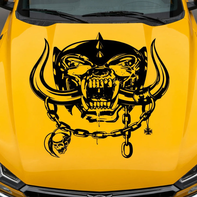 Yellow muscle car with aggressive war pig skull hood decal featuring tusks and chain design
