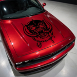 Red muscle car with aggressive war pig skull hood decal featuring tusks and chain design 