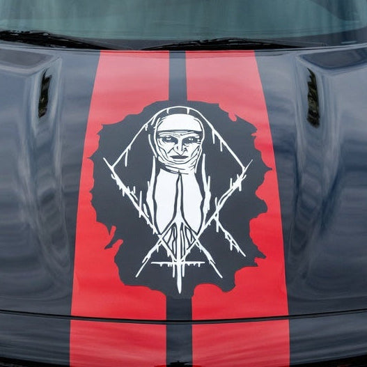 “White matte Nun‑inspired wall/hood decal, large size, high‑contrast silhouette on smooth painted surface”