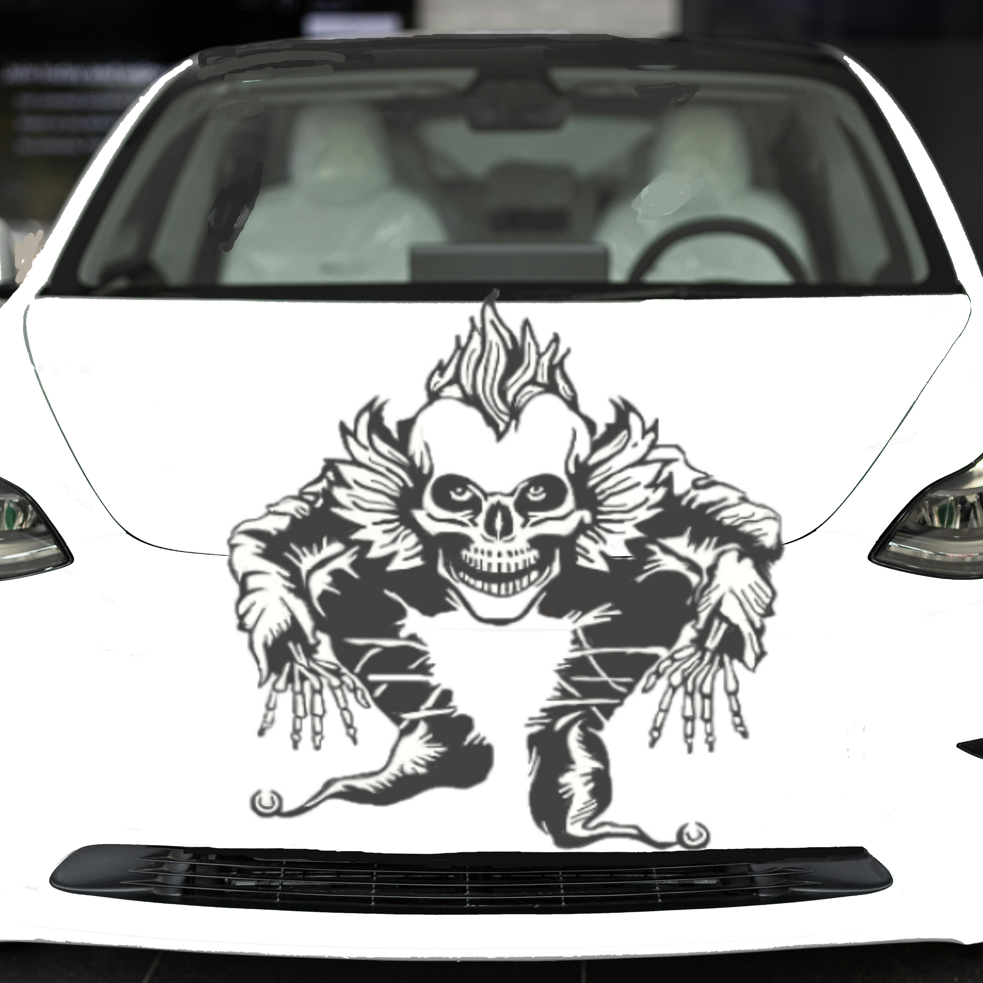 White car with a skull  design on the hood