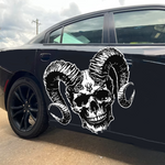 “Skull with Horns vinyl car/wall decal, white, 33×26 in, die‑cut with no background on black door”