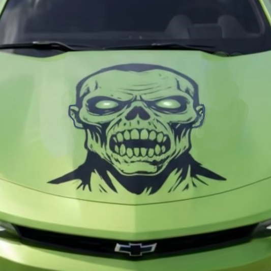 Green car with a skull decal on the hood
