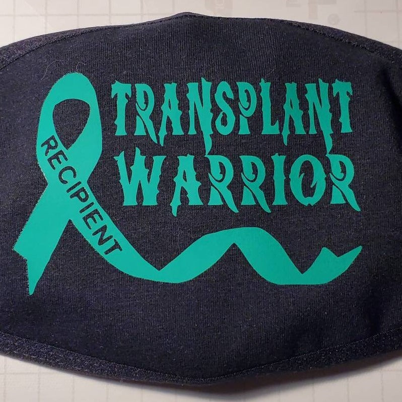 “Transplant Warrior" cotton face mask with green HTV graphic, approx. 4×3 in, reusable, non‑medical
