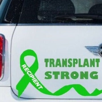 “Transplant Strong vinyl car window decal, green, 9‑inch width, die‑cut with no background on vehicle