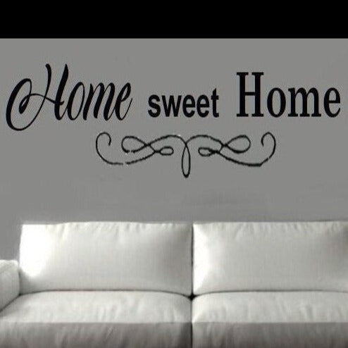 “Home Sweet Home vinyl wall decal in matte black, 20×10, applied to smooth painted wall”