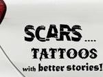“Black ‘Scars — Tattoos with Better Stories’ car decal on light tailgate, 11‑inch width, high‑contrast lettering”