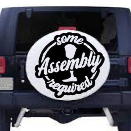 Black ‘Some Assembly Required’ handicapped humor car decal on light tailgate, high‑contrast lettering