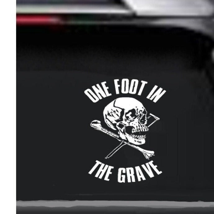 “One Foot in the Grave" vinyl car window decal, white, 15×20 in, die‑cut with no background on tinted rear glass