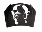 “Zombie vinyl hood/wall decal, white, die‑cut with no background on dark vehicle hood”