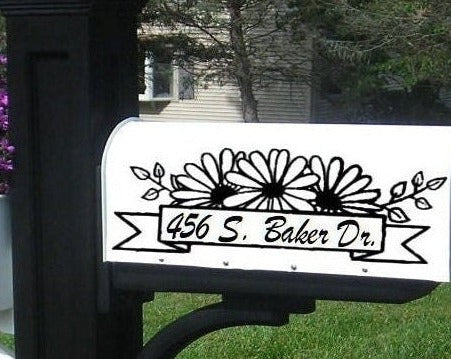 Mailbox decal with daisies flanking a banner, custom family name, black vinyl on black mailbox, approx. 12×6in”