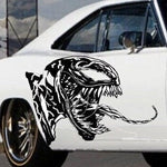 “Venom‑inspired vinyl car/wall decal, white, die‑cut with no background on dark hood”